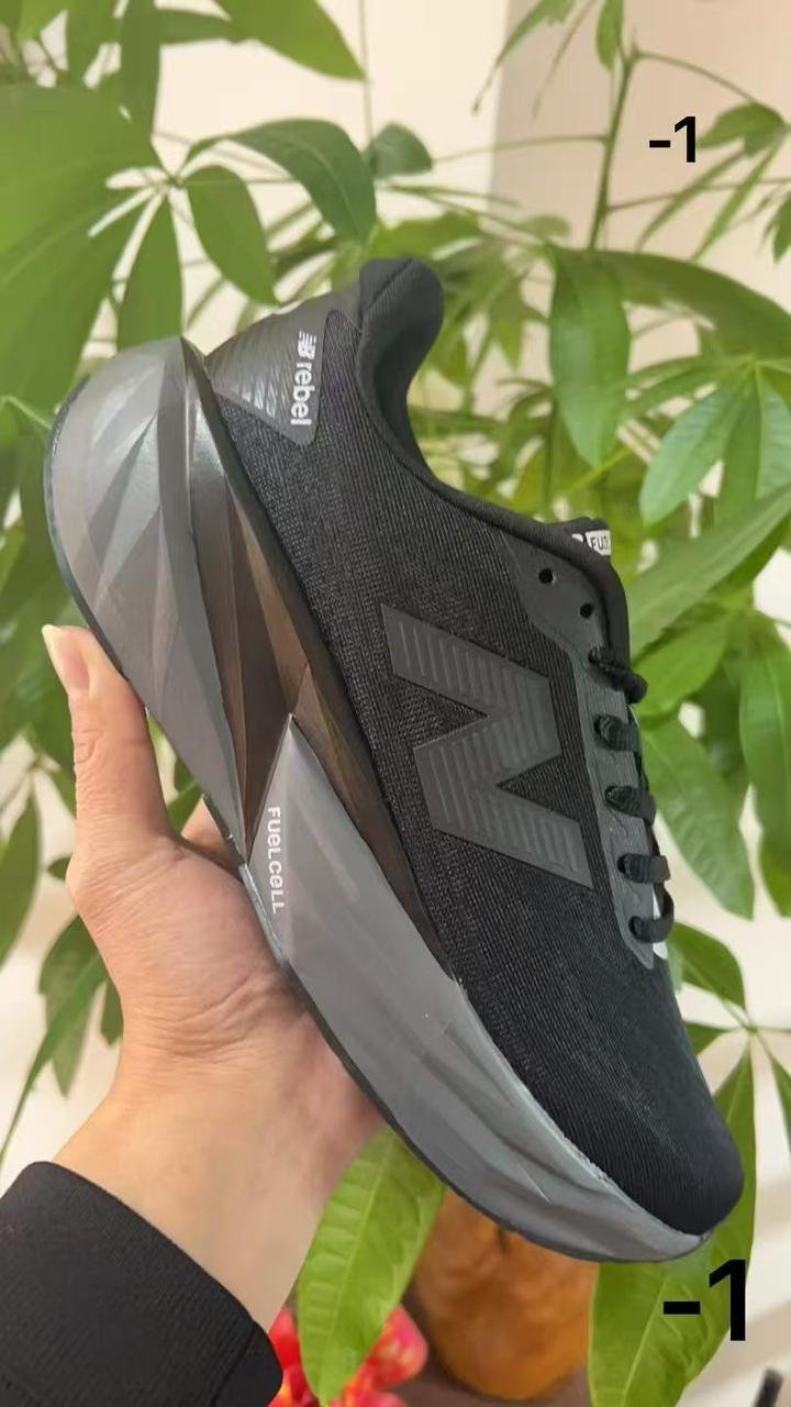 New Balance Rebel Triple Black Running Sneakers