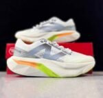 New Balance White & Blue Sneakers with Neon Orange Accents